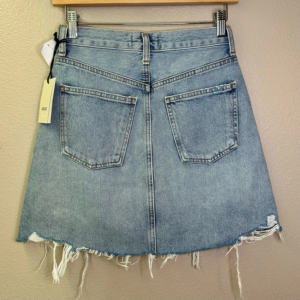 NWT Agolde Criss Cross Jean Mini Skirt Distressed Light Blue Frayed Hem Denim